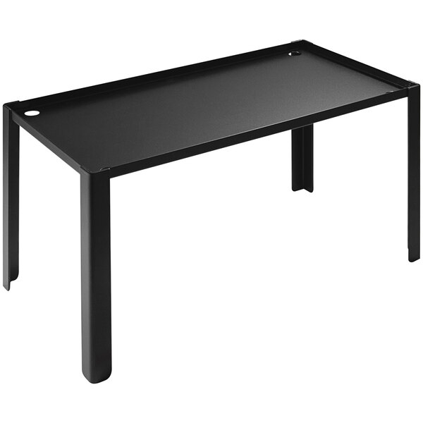 A black rectangular table with legs holding a black Abert Domino buffet podium.