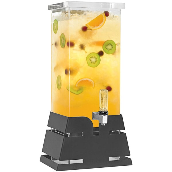 A Rosseto clear acrylic beverage dispenser with a black matte pyramid base filled with fruit and juice.
