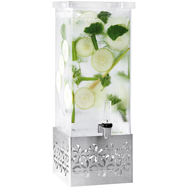 A Rosseto clear plastic rectangular beverage dispenser with a stainless steel base on a counter with cucumber water.
