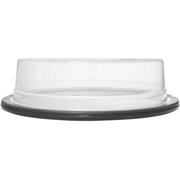 A clear plastic plate cover with a black rubber rim.