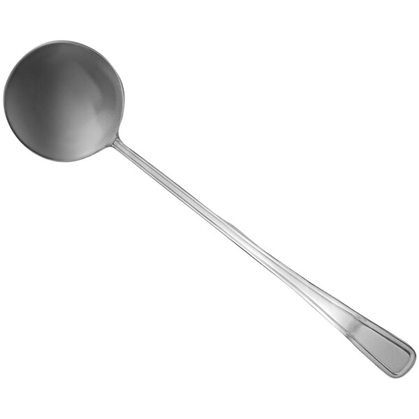A silver punch ladle with a round handle.