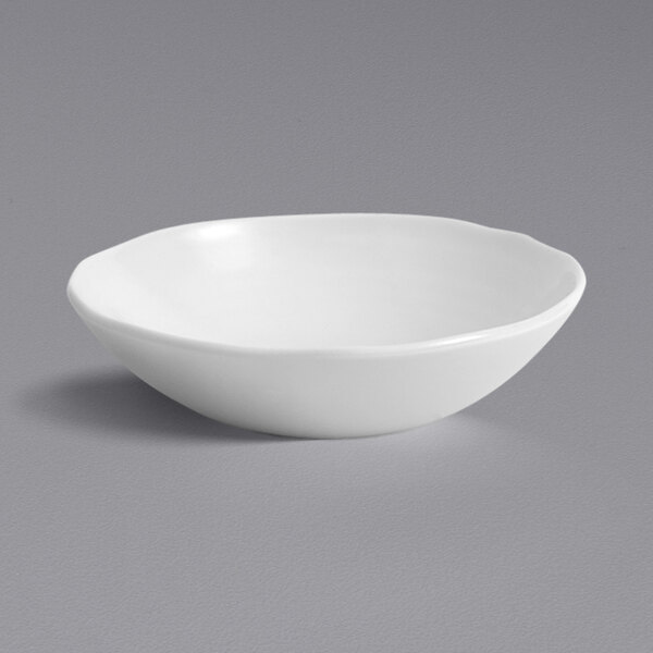 A Dudson Organic White china bowl on a gray background.
