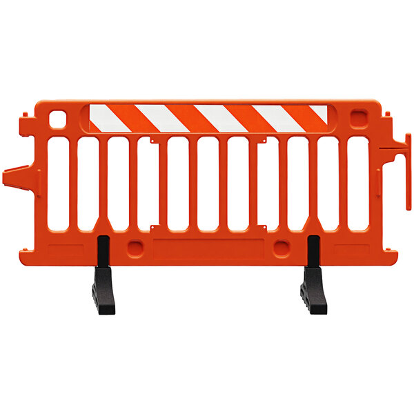 A Plasticade orange and white parade barricade with white and orange striped sheeting on the sides.
