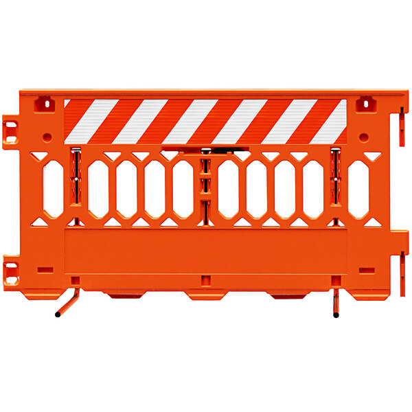 An orange Plasticade parade barricade with white striped sheeting on one side.