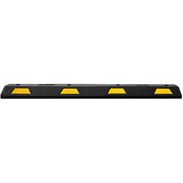 A Plasticade black rubber parking block with two yellow stripes.