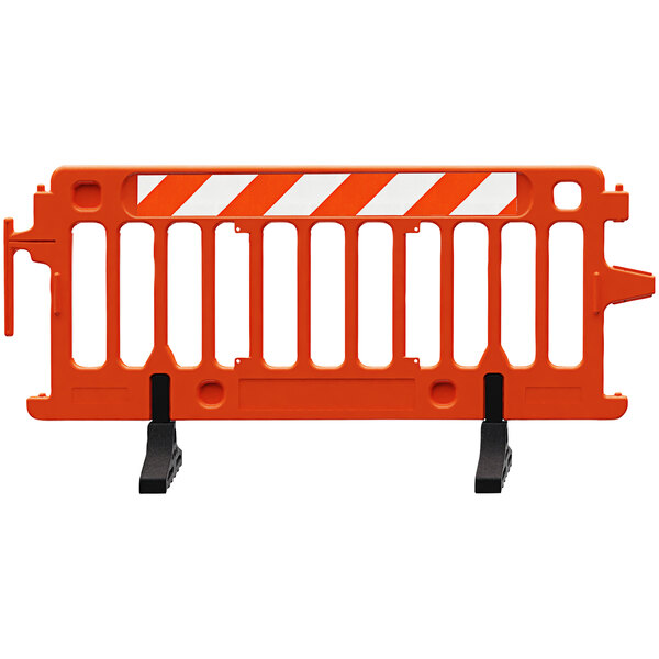 An orange Plasticade parade barricade with white engineer grade stripped sheeting on one side.