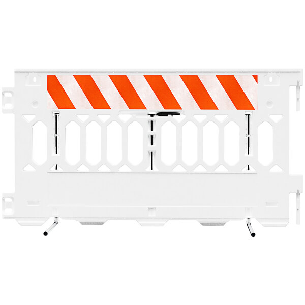 A white Plasticade parade barricade with white diamond grade striped sheeting on both sides.