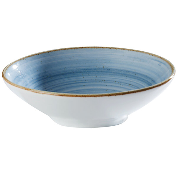 A close up of a blue and white Corona by GET Enterprises Artisan porcelain bowl with a gold rim.