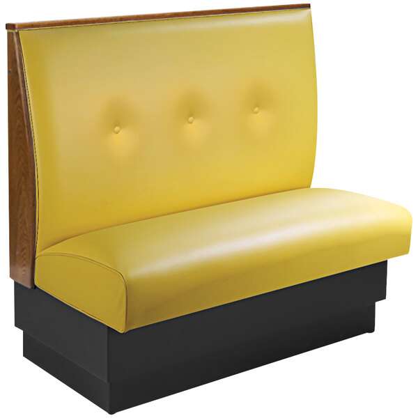 An American Tables & Seating yellow booth with black end caps and a 3-button tufted back.