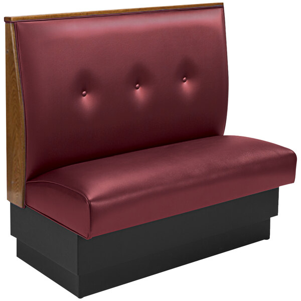 An American Tables & Seating red upholstered single booth with a 3-button tufted back and black legs.