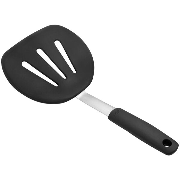 An OXO black silicone pancake spatula with a black handle.