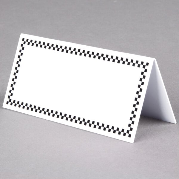 A white rectangular card with a black checkered border.