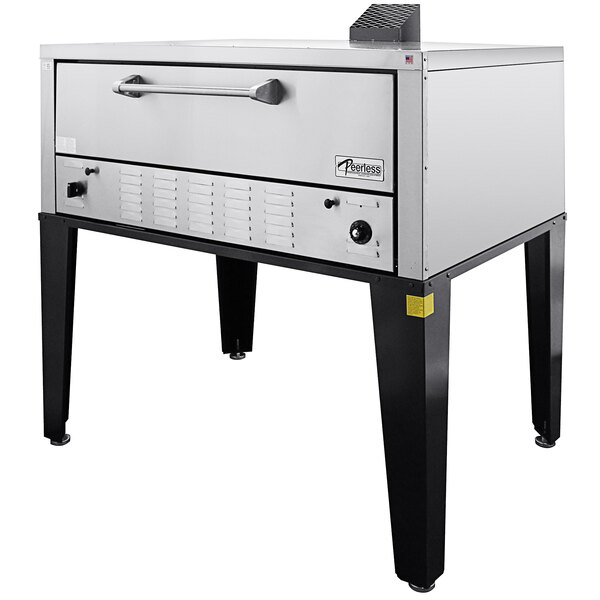 A large stainless steel Peerless pizza oven on a stand.