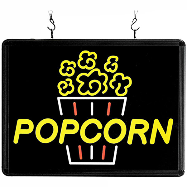 A rectangular LED sign with a red and white logo that says "popcorn" on a black background.