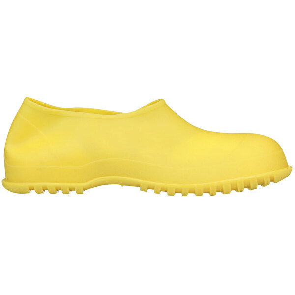 A yellow rubber Tingley Workbrutes overshoe with a black rubber sole.