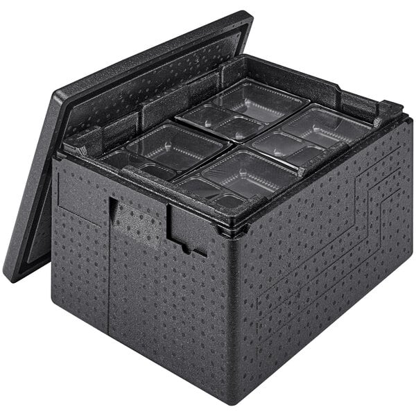 A black plastic Cambro Cam GoBox with many empty compartments inside.