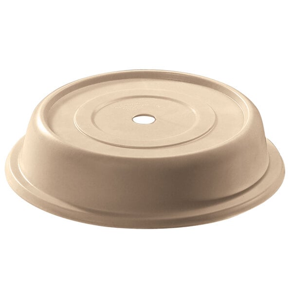 A beige plastic Cambro plate cover with a hole.
