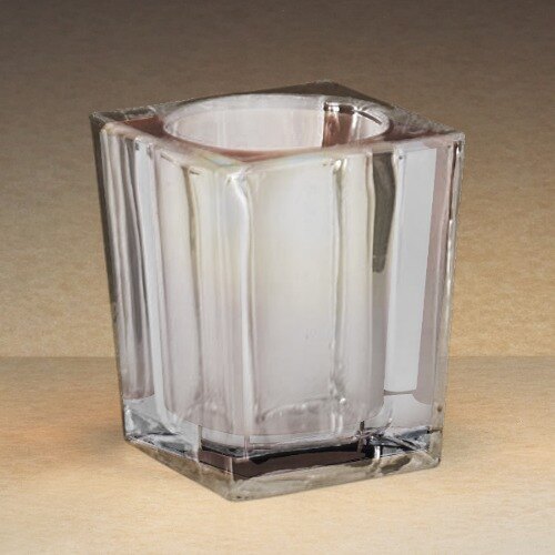 A close-up of a clear glass Sterno square liquid candle holder.