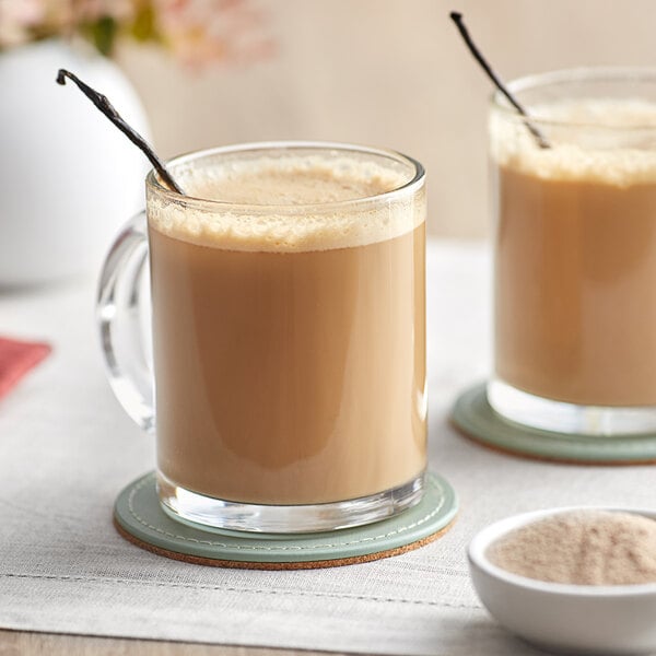 A bowl of David Rio Elephant Vanilla Chai Tea Latte Mix powder on a white background.