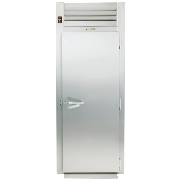 A Traulsen stainless steel reach-in refrigerator with a solid door open.