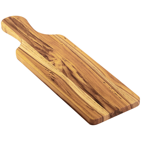 A Teakhaus teakwood serving board with a handle.