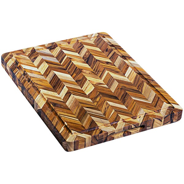 A Teakhaus wooden cutting board with a herringbone pattern.