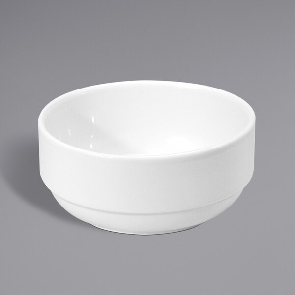 A Oneida Classic cream white porcelain bowl on a gray surface.