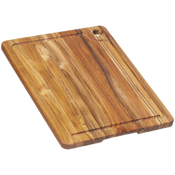 A Teakhaus edge grain teakwood cutting board with a handle hole.