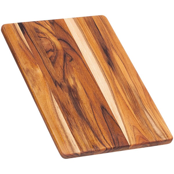A Teakhaus edge grain teakwood cutting board with a wood grain pattern.