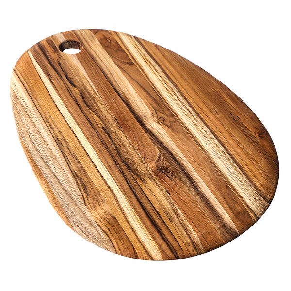 A Teakhaus teakwood oval serving board with a hole in the middle.