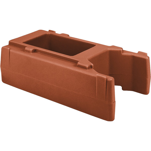 A brown plastic Cambro riser with a hole in the center.