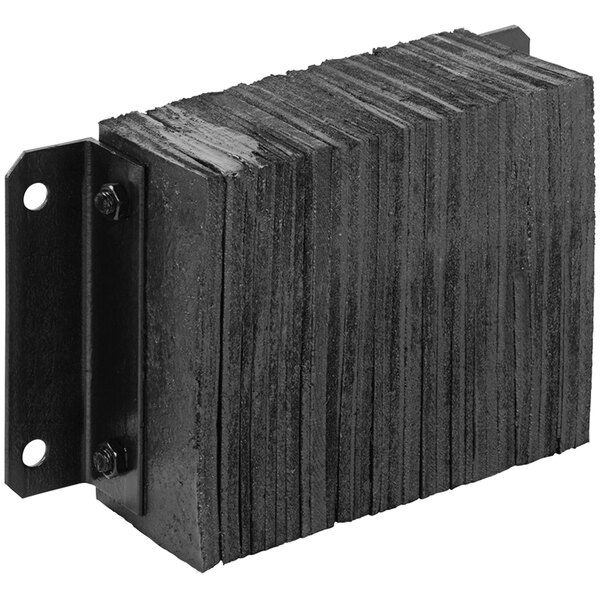 A stack of black rectangular rubber dock bumpers.