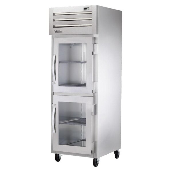 A stainless steel True holding cabinet with glass half doors.