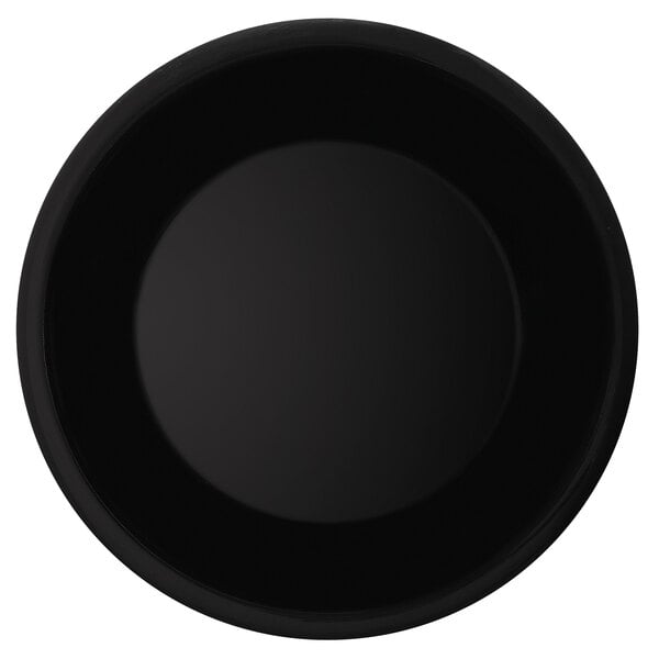 A close-up of a black plate with a wide rim.