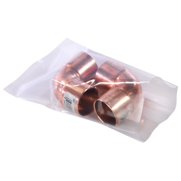 A close-up of a Lavex clear plastic bag holding two copper pipes.