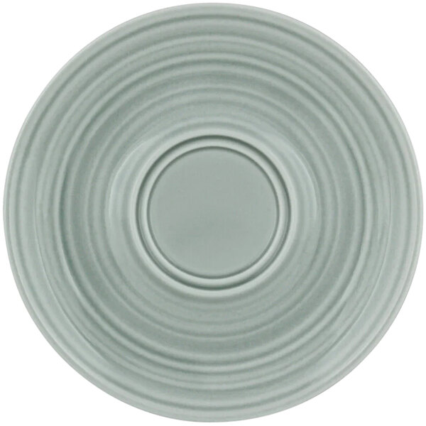 A Bauscher white porcelain saucer with a circular pattern.
