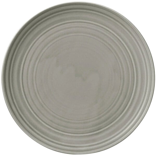 A white porcelain flat coupe plate with a gray circular pattern around the edge.