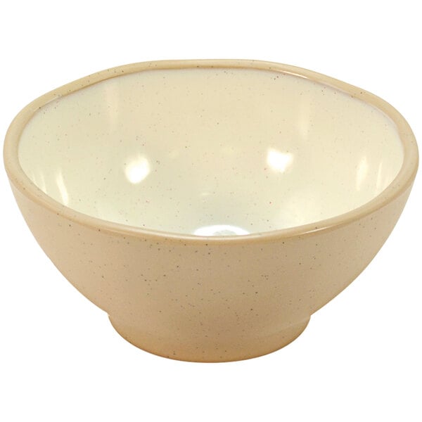 A beige bowl with a white rim.