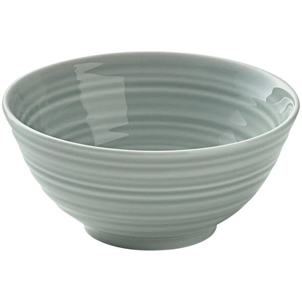 A close up of a Bauscher by BauscherHepp Country House white porcelain bowl with wavy lines.