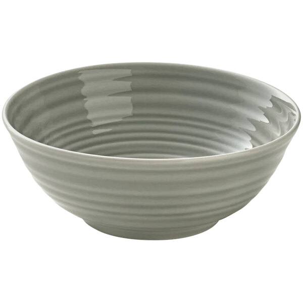 A white bowl with a curved pattern and gray interior.