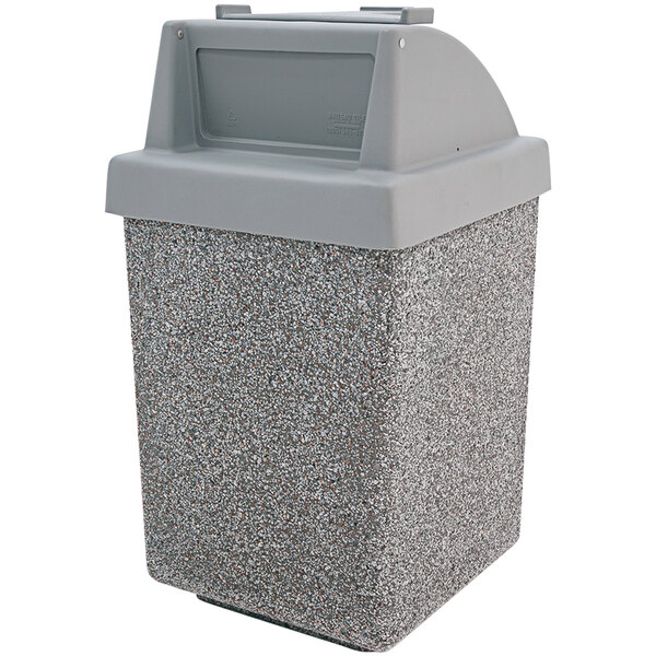 A grey Wausau Tile concrete trash receptacle with a plastic lid.