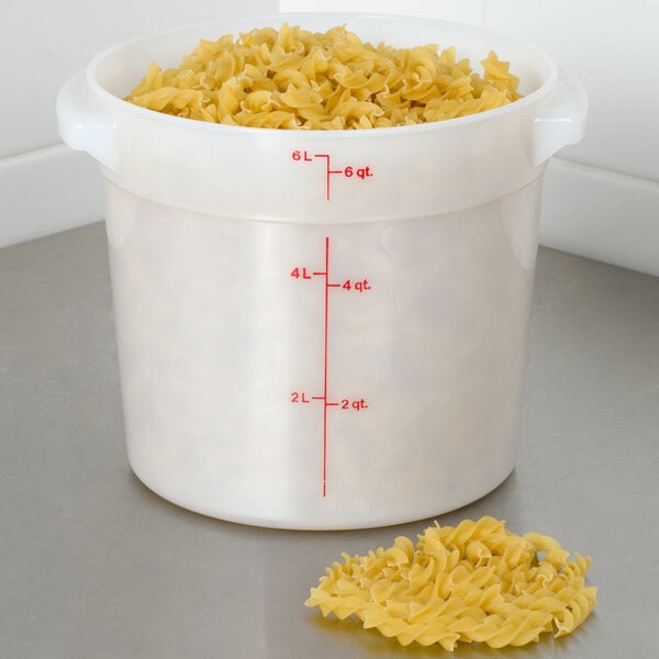 A white Cambro round plastic container filled with pasta.