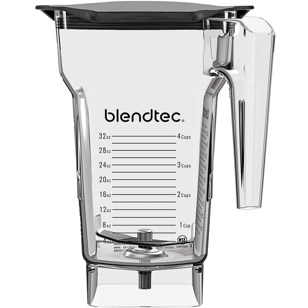 A clear Blendtec blender jar with a clear plastic lid and handle.