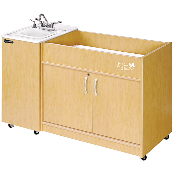 An Ozark River Manufacturing portable hand sink with a white laminate cabinet on wheels.