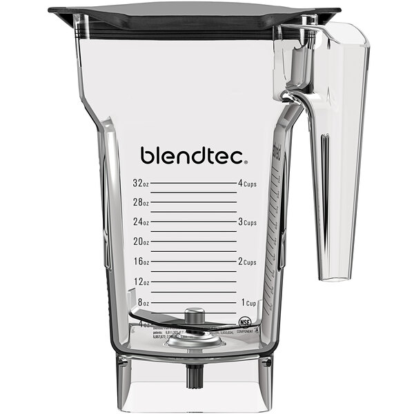 A clear Blendtec blender jar with a clear plastic lid and handle.