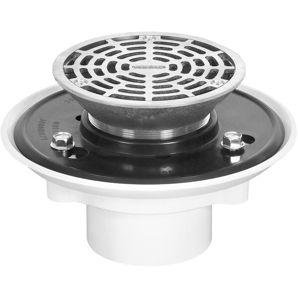 A round metal Josam floor drain with a round metal drain cover.
