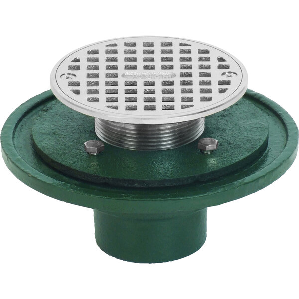 A green base with a metal Josam round floor drain with a green and silver strainer.