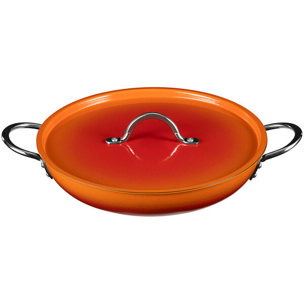 A Bon Chef Ombre Tangerine saute pan with a lid.