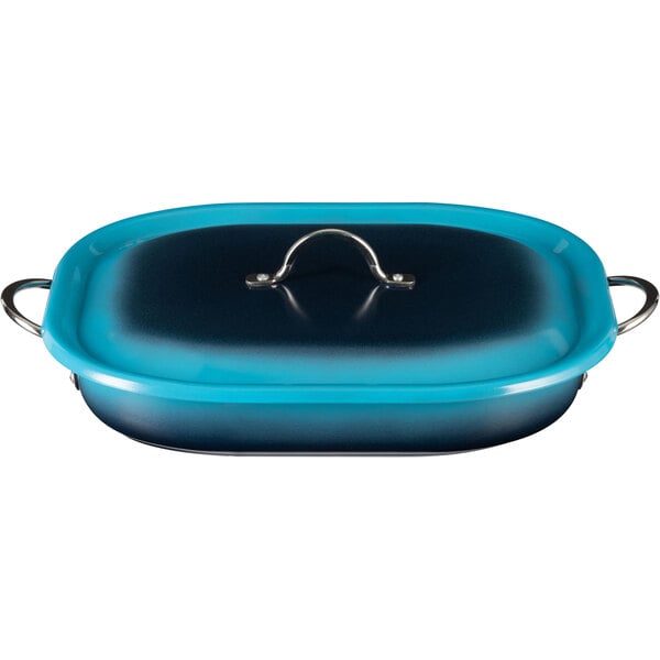 A blue and black Bon Chef Country French roasting pan with a handle.