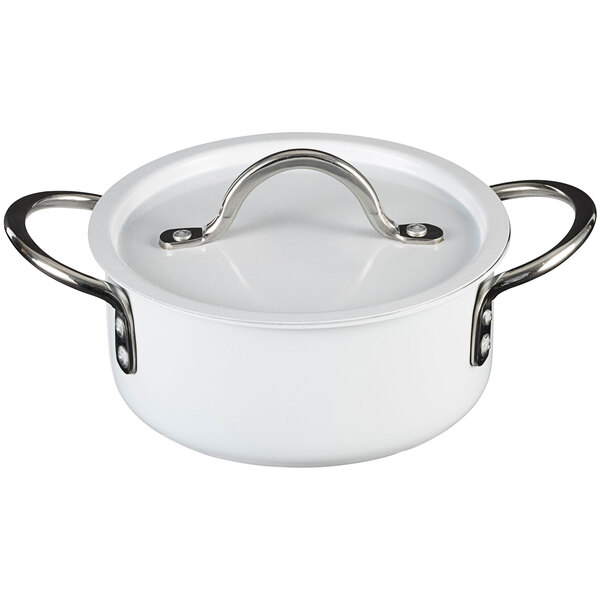 A white Bon Chef sauce pot with silver handles.